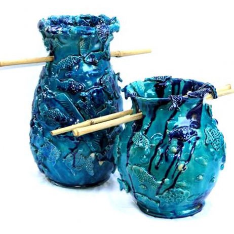 A pair of ceramic turquoise vases